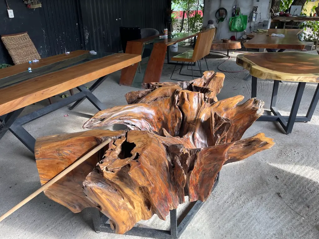 A look at a unusual wooden table with other tables around